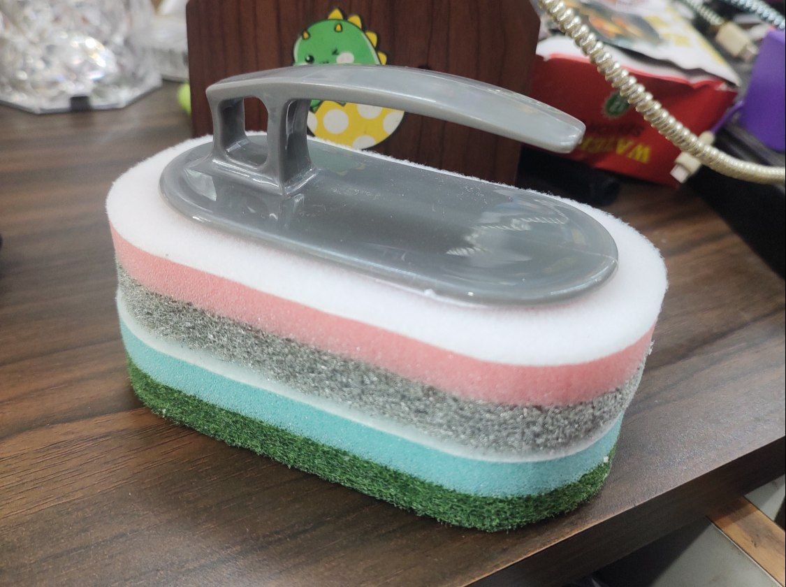 multi-layered cleaning sponge with a plastic handle